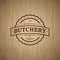 Butchery vintage logo. Fresh meat market. Embossed logo on vintage wooden background.