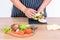 Butler is cooking a hamburger Which contains fresh vegetables