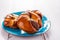Butter buns with nutlet on blue plate partial blur