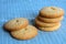 Butter cookies biscuits pile on blue kitchen cloth close up photo. Breakfast or dessert bakery product. Homemade pastry