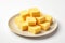 butter cubes on a white plate, created by Generative AI