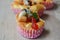 Butter cupcake topping dries fruit and peanut in paper