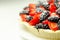 Butter enriched shortcrust pastry topped strawberries and blackberries, seasonal cake with colorful decoration