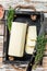 Butter Margarine block in a wooden tray with herbs. White wooden background. Top view