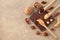 Butter, nut paste in wooden spoons with ingredients on a light background. Homemade Raw Organic Hazelnut, Peanut, Walnut. Concept