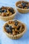 Butter tarts with dried fruit on the marble background