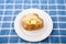 Buttered Baked Potato on Blue Plaid Placemat