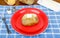 Buttered Baked Potato on Red Plate