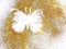 Butterfly of gold glitter on white background