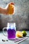 Butterfly pea flower blue iced tea or lemonade. Healthy detox herbal drink.