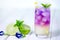 Butterfly pea flower drink with lime , honey and mint leaf , a f