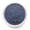 Butterfly pea flower powder or blue matcha in round bowl isolated on white. Top view