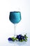 Butterfly pea herbal blue drinks into wine glass vertical