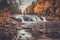 Buttermilk Falls surrounded by brilliant fall foliage in Long Lake NY, ADK Mountains