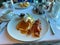 Buttermilk pancakes, bacon and coffee breakfast at a restaurant on a cruise ship