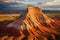 The Buttes of the Vermillion Cliffs National Monument in Arizona, Aerial view of a sandstone Butte in Utah desert valley at sunset