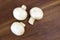 Button mushrooms Agaricus bisporus on wood