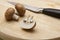 Button mushrooms being cut