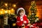 Buy christmas gifts online. Christmas shopping concept. Holidays and winter childhood concept. Smiling little boy in