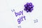 Buy gift text an a monthly calendar with a purple bow