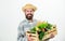 Buy local foods. Farmer rustic bearded man hold wooden box with homegrown vegetables white background. Farmer guy carry