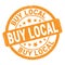 BUY LOCAL text written on orange round stamp sign