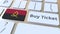 BUY TICKET text and flag of Angola on the buttons on the computer keyboard. Travel related conceptual 3D animation