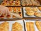 buyer choosing fruity tarts in bakery tray