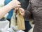 Buyer and seller exchange goods and cash at the time of purchase at the flower counter