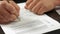 Buyer signing contract closeup, official document approval, real estate purchase