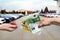 `Buying car` concept, hands with euro banknotes close up