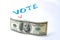 Buying votes of voters concept. Vote, dollars on a white background