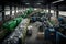 a buzzing and busy recycling center, with conveyor belts and machines sorting recyclables into different bins
