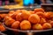 BuÃ±uelos de Viento - Light and fluffy fried dough balls, often filled with cream or custard