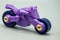 bycycle. plastic toy violet bycycle. batman batcycle isolated on gray background. plastic batman batcycle.