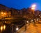 Bydgoszcz by night. Picturesque channels of the Brda River flowing through the city center. Old historic factory and residential