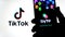 Byte app on the silhouette of smartphone and TikTok logo on a blurred background screen. Byte is the sequel to Vine app. Real phot