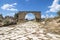 Byzantine road with triumph arch with blue sky in ruins of Tyre, Lebanon