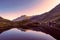 BÃ¢lea Lake in the FÄƒgÄƒraÈ™ Mountains, Sibiu County. Reflection of the cottage in the water of the lake at sunset. Picture taken