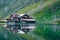 BÃ¢lea Lake in the FÄƒgÄƒraÈ™ Mountains, Sibiu County. Reflection of the cottage in the water of the lake at sunset. Picture taken