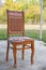 C lassic brown chair. wooden chair green background . Old chair on nature background . Old style wooden chair
