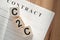 C2C abbreviation - consumer to consumer, on wooden cubes on background of contract