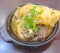 Cabbage clay pot with black rice cakes closeup