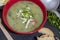 Cabbage cream soup in a red bowl