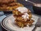 Cabbage pancakes, sour cream poured close-up, cutlery. Side view