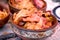 Cabbage with smoked meat - sauerkraut with pork, veal beef and lamb in earthy bowl
