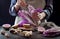 Cabbage and watermelon radish kimchi ingredients. Woman salting purple cabbage for kimchi. Fermented probiotic food for gut health