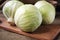 Cabbage on a wooden board on a background sacking, burlap