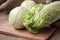 Cabbage on a wooden board on a background sacking, burlap