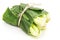 Cabbage wrapped with banana leaves tied with banana rope